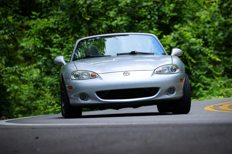 Head-on view of the Miata cornering on the Tail of the Dragon with the top down.