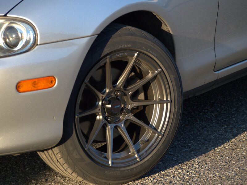 Close view of the front wheel arch: a gunmetal Advanti Storm S1 wheel with a Yokohama tire, against the car's silver bodywork.